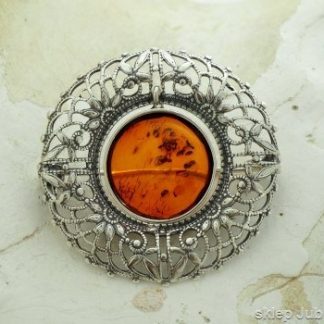 VENUS - srebrna ażurowa broszka z bursztynem