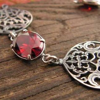 CORSA - srebrna bransoletka z granatem