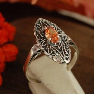 ONDA - srebrny pierścionek z topazem złocistym