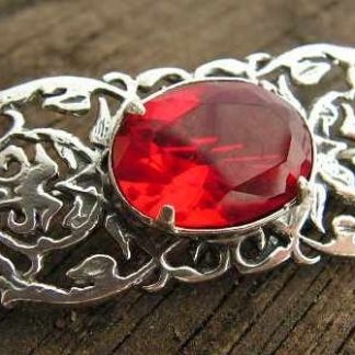 SABOTINI - srebrna broszka z rubinem